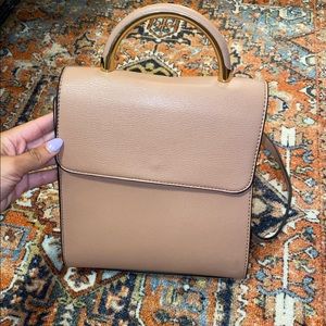 blush pink backpack with gold handle 🤍